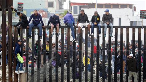 Members of migrant caravan remain defiant after US again denies border ...