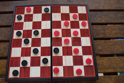 Board with Checkers in Black and Red Stock Photo - Image of checkerboard, finger: 176881776