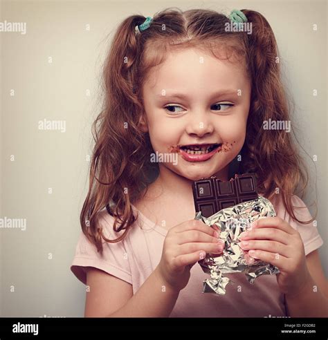 Child eating chocolate hi-res stock photography and images - Alamy