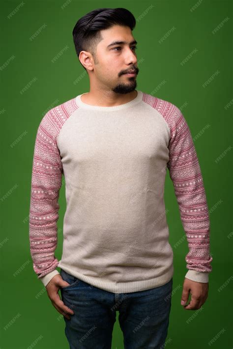 Premium Photo | Young bearded iranian man on green