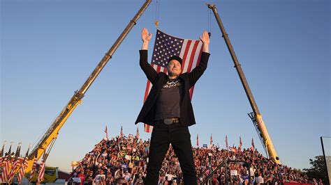 Excited Elon Musk JUMPS on to stage to join Trump in Butler as he ...