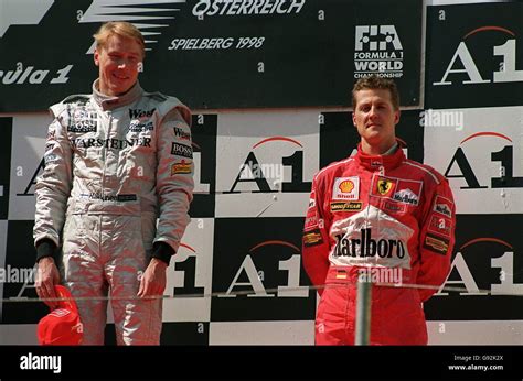 Race winner mika hakkinen left third placed michael schumacher right hi ...