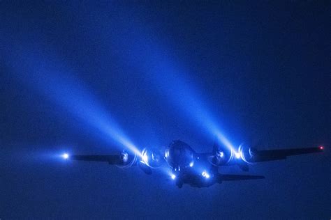 US Air Force C-130 Hercules transport aircraft conducting night flight ...