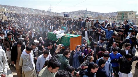 Afghanistan buries woman beaten to death by mob