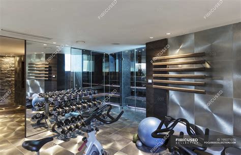 Gym with equipment in modern luxury home showcase interior — wealth, indoors - Stock Photo ...