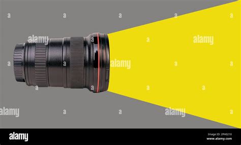 Wide-angle lens of professional camera, side view. Photo zoom lense 16 35 mm isolated on white ...