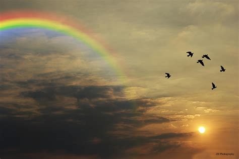 Tranquil Sunset And Rainbow Photograph by Jay Harrison