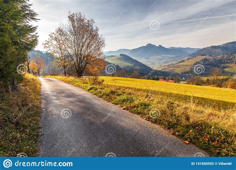 A Narrow Road through an Autumn Landscape with Mountains Stock Photo - Image of hunting, open ...