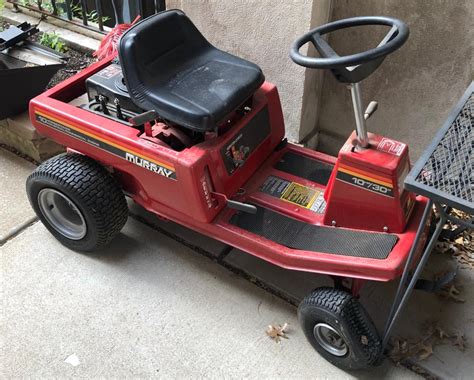 Lot - Murray riding lawn mower / tractor with accessories.