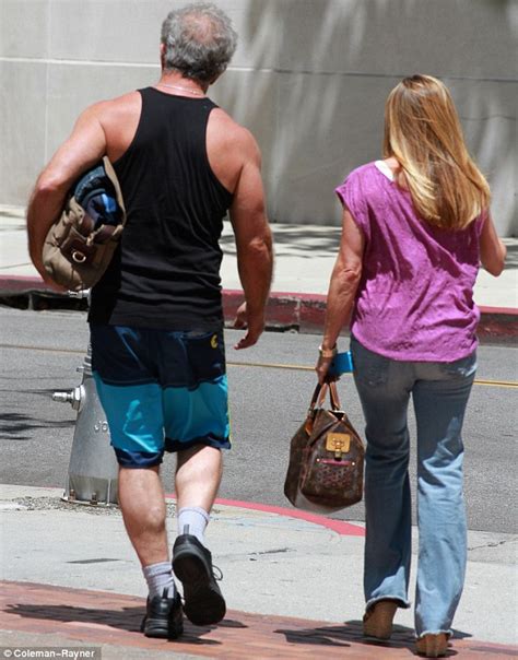 Mel Gibson, 58, shows off his bulging biceps after finishing up a ...