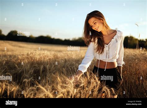 Young beautiful woman spending time in nature Stock Photo - Alamy