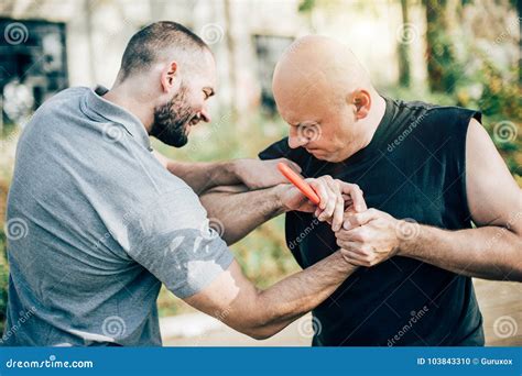 Self Defense Disarming Technique Against Threat and Knife Attack Stock Photo - Image of lock ...