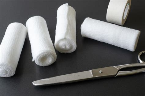 Premium Photo | Medical bandages with scissors and sticking plaster medical equipment