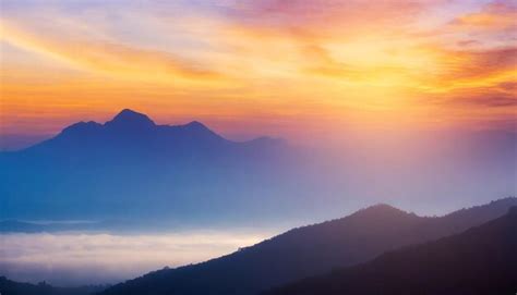 Premium Photo | Conceptual background beautiful sunset and mountain ...