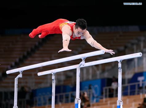 Chinese gymnast Zou claims men's parallel bars title at Tokyo Olympics ...