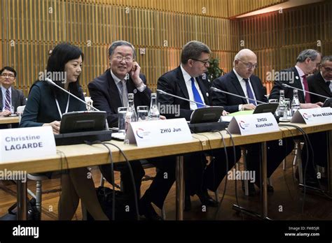 Paris, France. 31st Mar, 2016. Chinese central bank governor Zhou Xiaochuan (3rd L) reacts ...