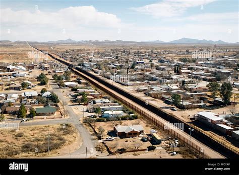 Aerial photograph of the US-Mexico border fence in Arizona. See ...