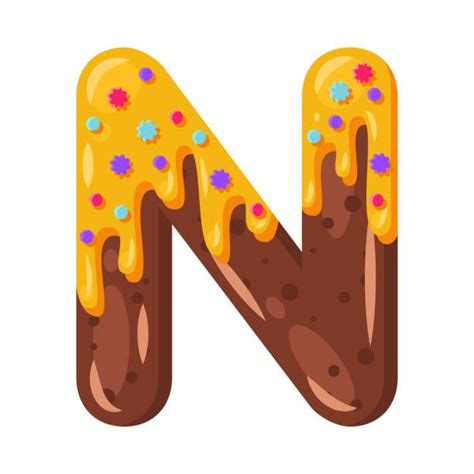 the letter n is decorated with icing and sprinkles
