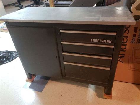 Craftsman workbench with drawers and door 48X 20D on rollers.with contents...BASEMENT - Bid ...