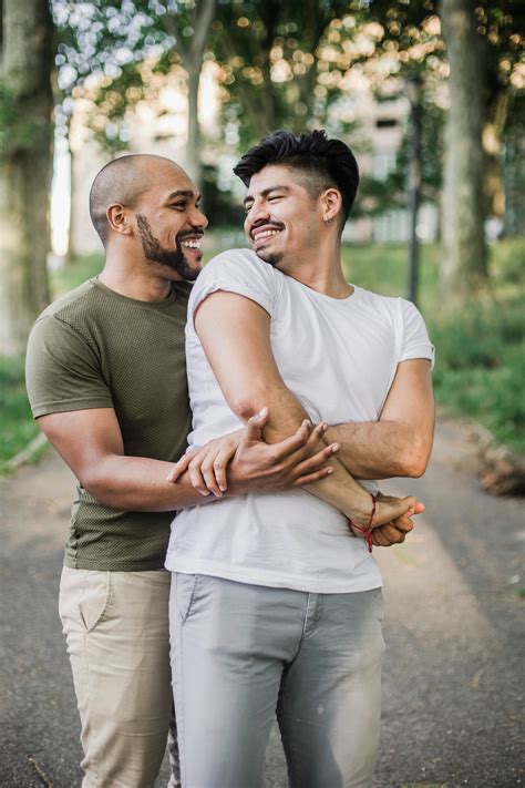 Two Men Holding Hands and Looking at Each Other · Free Stock Photo