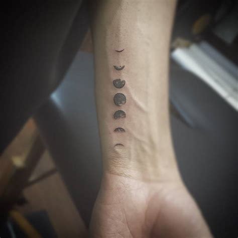 Small moon phases tattoo on the wrist - Tattoogrid.net