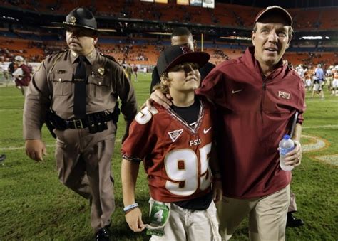 Florida State coach Jimbo Fisher, right, walks off the field with his son Trey following the ...