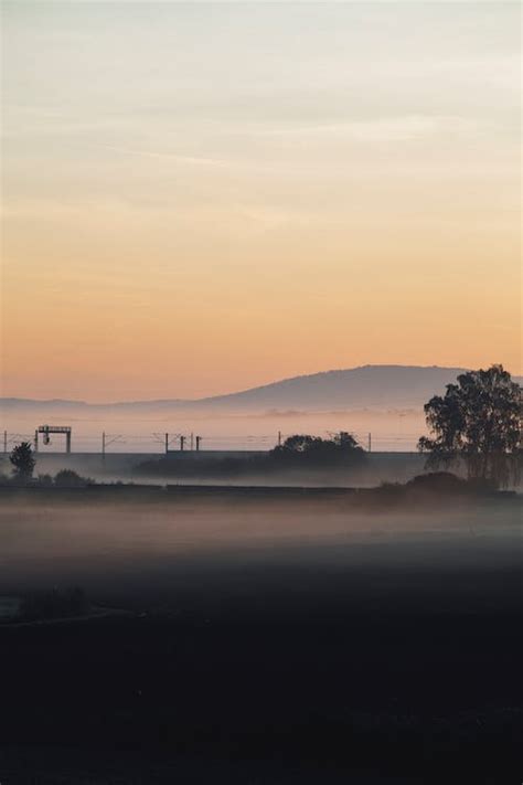 Silhouette of Mountain During Sunrise · Free Stock Photo