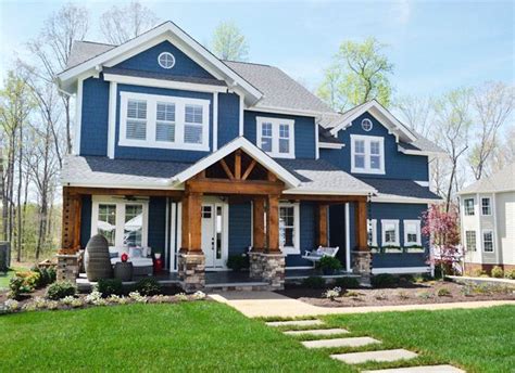 I love this colour scheme of this exterior; navy blue, white and wooden stain. Blue Siding, Wood ...