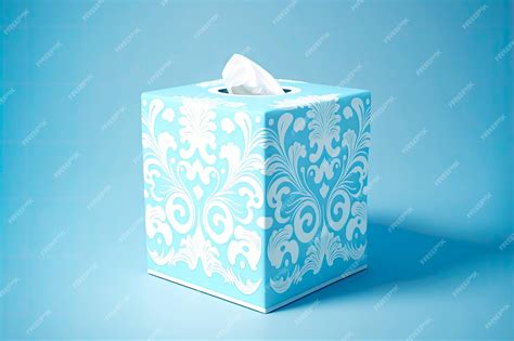 Premium Photo | Blue tissue box with white paper pattern on blue background