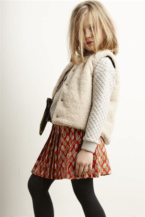 Really loving all the texture here in her quilted top and fleecey vest. Sporty chic score ...