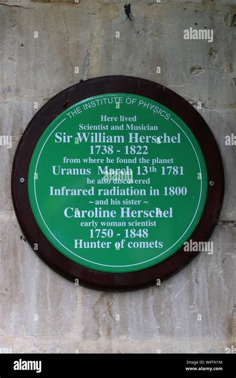 Green plaque on wall at William Herschel museum in Bath for Institute of Physics with details of ...