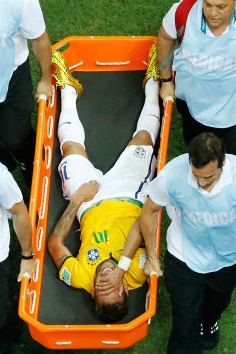 Neymar was stretchered off with a back injury after being clattered by ...