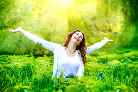 Woman sitting in the grass happy Stock Photo free download