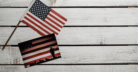 American Flag on White Wooden Wall · Free Stock Photo