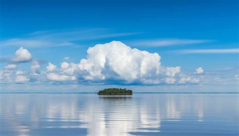 Tranquil scene of blue water reflects beauty in nature solitude ...