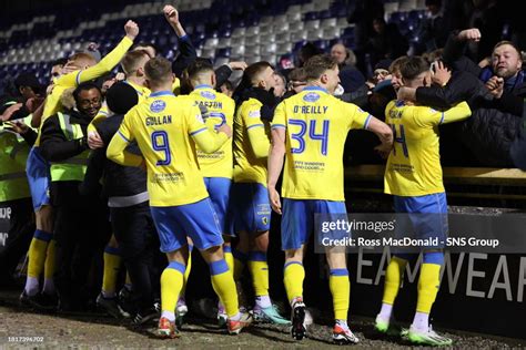 Raith Rovers players celebrate with fans after Jamie Gullan scores to ...