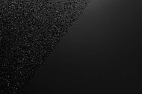 Premium Photo | Shiny water drops on black surface background water ...