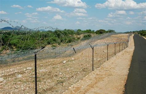 Border high security fence stock image. Image of divide - 49043923