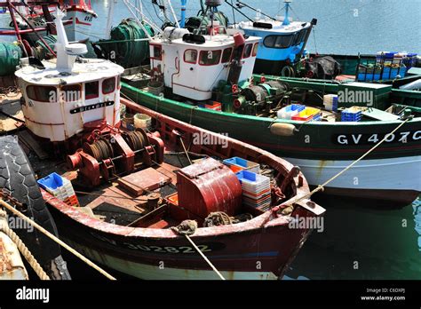 Colourful trawler fishing boats in the Guilvinec port, Brittany, France Stock Photo - Alamy