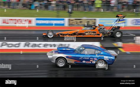 Super Pro drag racing at Santa Pod, driven by Bob Doyle (Datsun 260Z) nearside, Peter Walters ...