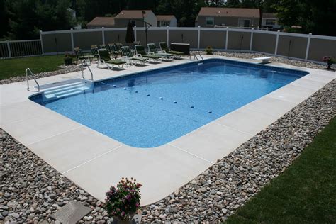 Rectangle style pool with brushed concrete decking. http://www ...