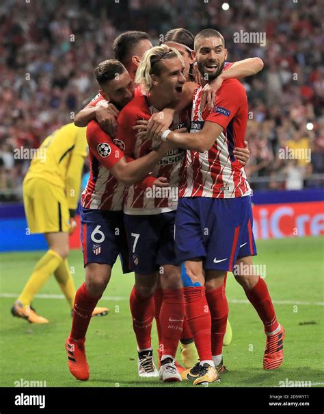 Atletico Madrid's Antoine Griezmann (centre) celebrates after scoring ...