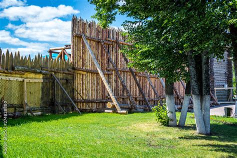 Medieval wooden fence made of palisade Stock Photo | Adobe Stock