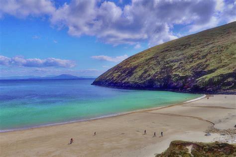 Walkers On Keem Beach, Achill Island Feted By The Green Atlantic Ocean ...