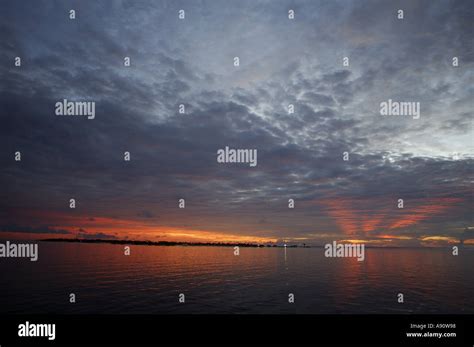 Maldives a sunset on the ocean Stock Photo - Alamy