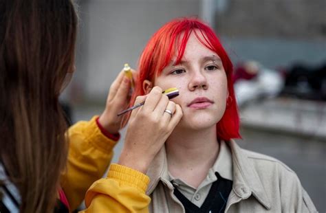 Free Photo | Person painting a non binary flag on a friend