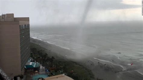 Beachgoers scramble as tornado moves up popular US beach - CNN Video