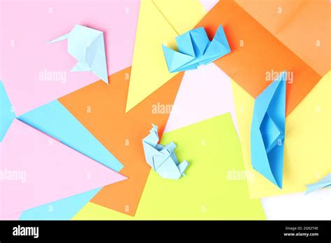 blue origami on bright paper background Stock Photo - Alamy