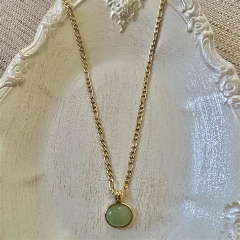 This elegant green gem stone necklace not only will... - Depop