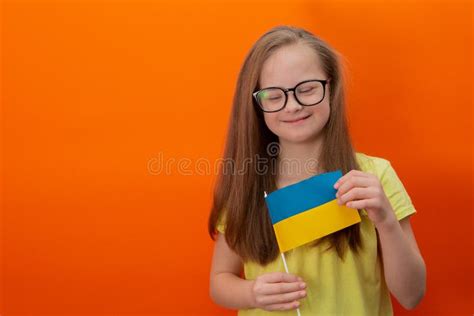 A Girl with Down Syndrome Holds the Flag of Ukraine Stock Image - Image ...